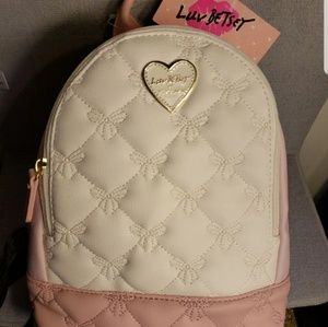 Luv Betsey Pink and white small quilted backpack.